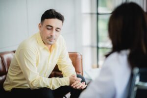 man talking with a girl therapy